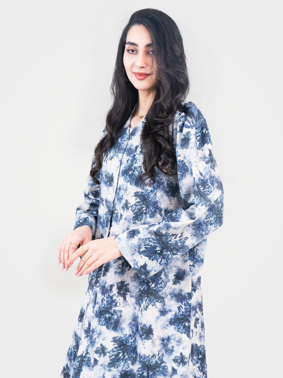 Indigo Canvas Abaya three-quarter view showing relaxed flowing silhouette in indigo ink-wash print lightweight fabric UAE